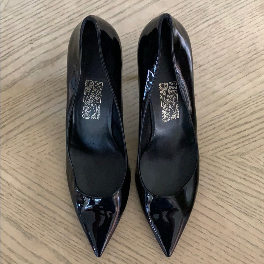 Black patent leather Salvatore Ferragamo 3” pumps.